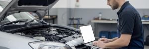 ADAS calibration in Bradford with a technician using a laptop to calibrate vehicle systems